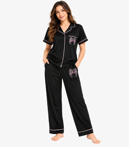 Front view of Juicy Couture women’s black pyjama set with pink piping, Juicy Angel graphics and wide-leg trousers