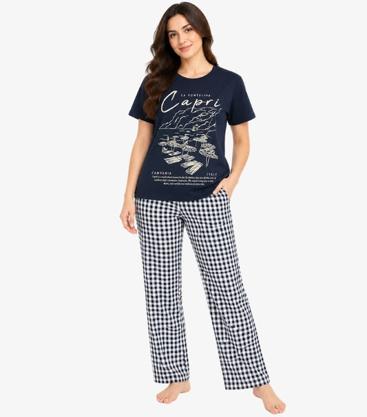 Front view of a model wearing a Marks & Spencer Capri graphic T-shirt pyjama set with check-pattern bottoms and side pockets