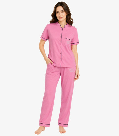 Juicy Couture pink pajama set front view showing mandarin collar button-down top with chest pocket crown logo and matching pants