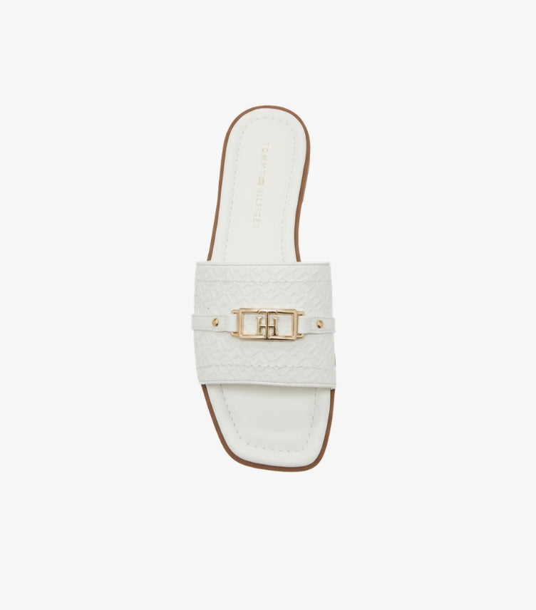 TOMMY HILFIGER WOMEN’S EMBOSSED MONOGRAM SLIDES