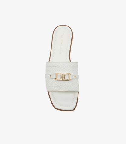 TOMMY HILFIGER WOMEN’S EMBOSSED MONOGRAM SLIDES