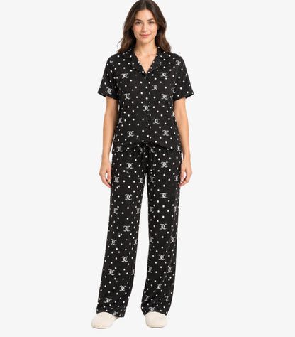 Front view of Juicy Couture monogram polka-dot pajama set with short-sleeve button-up shirt and drawstring trousers