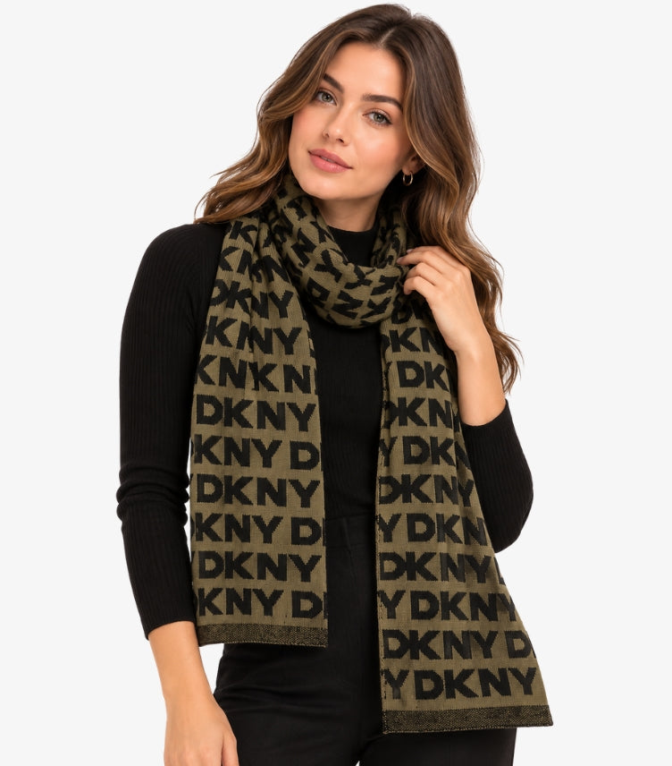 Woman wearing a DKNY olive and black knitted muffler featuring an all-over repeat logo pattern