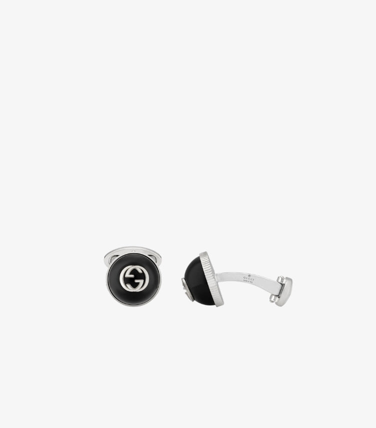 Gucci Interlocking G round cufflinks featuring signature GG logo and polished metal finish front view
