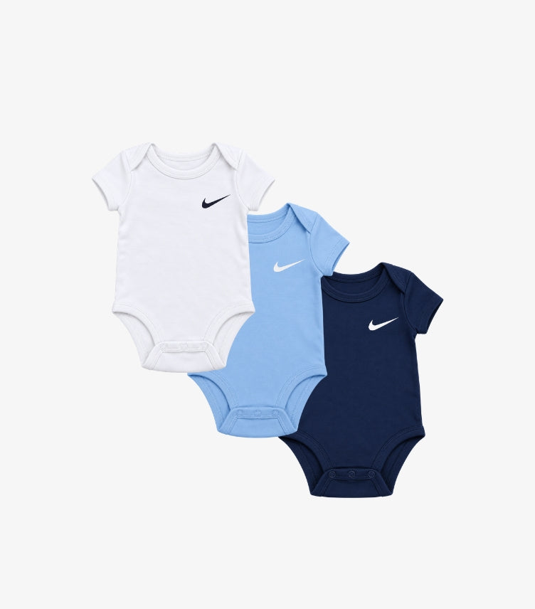 Nike baby boys 3-pack short sleeve bodysuits featuring signature Swoosh chest logos, envelope-style necklines and bottom snap closures.
