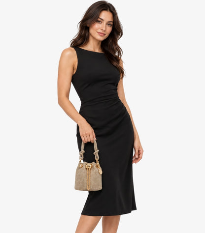 Woman holding ALDO crystal-embellished mini bucket bag with gold-tone drawstring and knotted handle