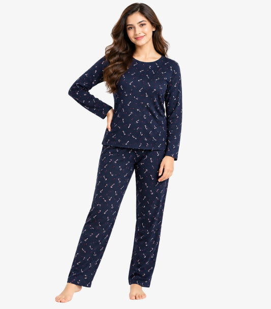 Woman wearing M&S long sleeve printed pyjama set with crew neck top and matching full-length trousers front view