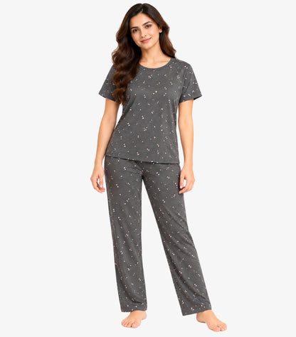 Woman wearing M&S short sleeve printed two-piece pyjama set featuring crew neck top and relaxed full-length trousers front view