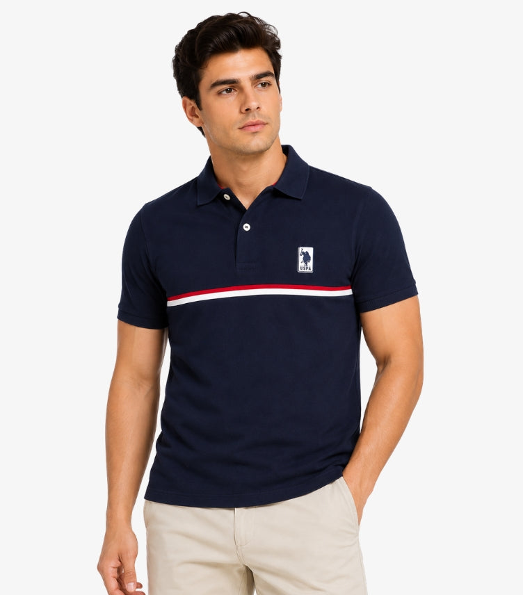 U.S. Polo Assn. men's navy piqué polo shirt with red white chest stripe and USPA badge logo front on-model view