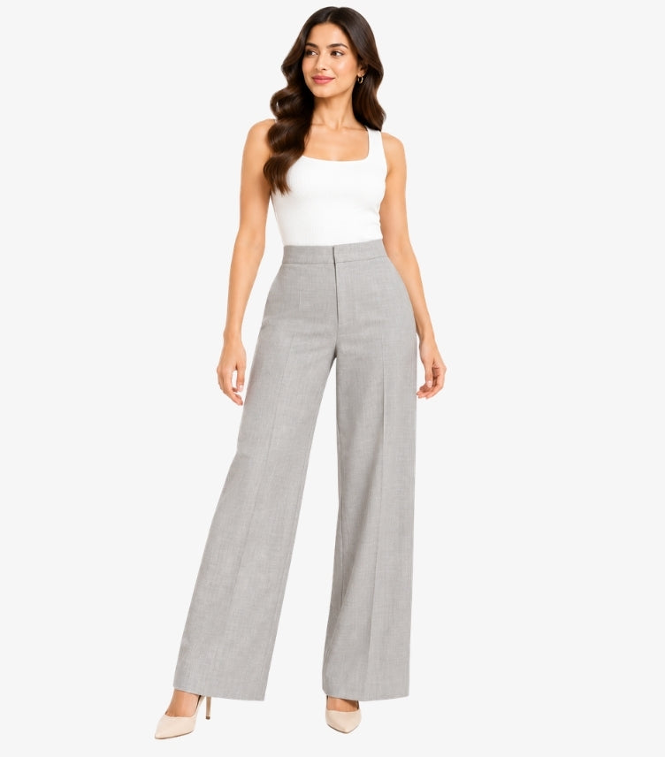 Front view of a model wearing Zara high-waisted wide-leg tailored pants with a structured waistband and full-length silhouette