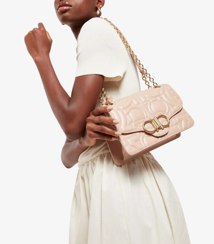 Ferragamo Gancini Quilted Bag Nude Blush – model carrying on gold chain shoulder strap | A&B Imported UK