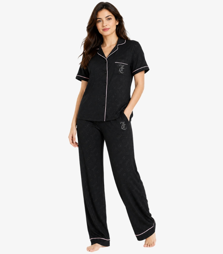 Juicy Couture black pajama set front view showing tonal print notch collar white piping and rhinestone JC monogram on pocket and trousers