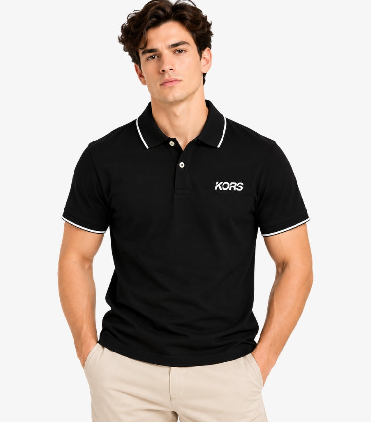 Man wearing a Michael Kors black short-sleeve polo shirt with white piping and a bold KORS chest logo