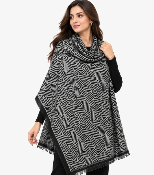 DKNY Women's Black and Grey Geometric Print Shawl featuring an abstract pattern, contrasting black border and fringed edges, styled on a female model.