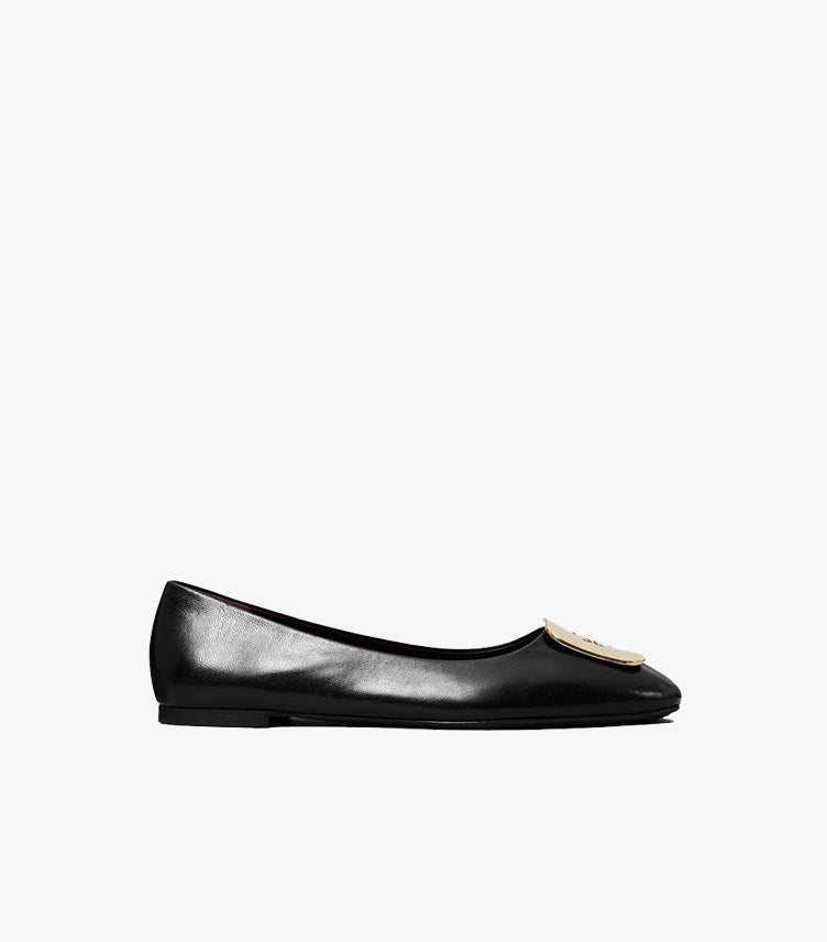 Side view of Tory Burch black square-toe ballet flat with oversized gold-tone Double T logo plaque