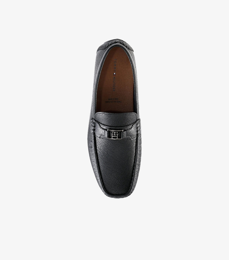 Top view of Tommy Hilfiger men's black leather slip-on driver loafer featuring premium textured leather and signature metal logo.