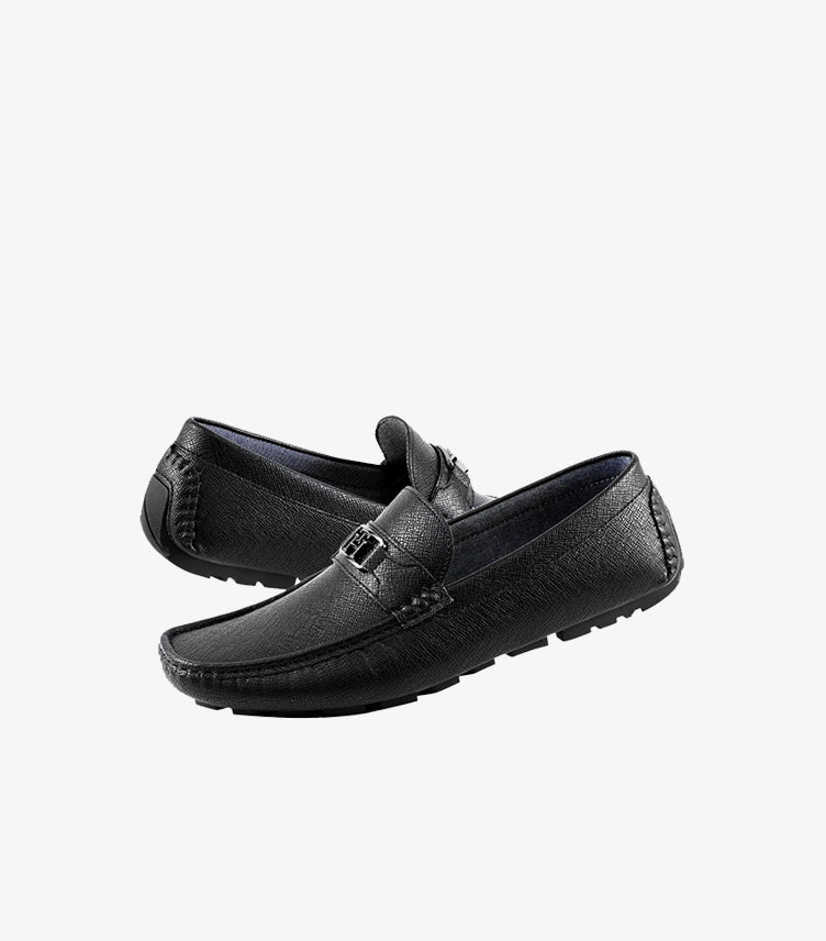 Tommy Hilfiger men's black leather driver loafers with textured finish, metal logo detail, and flexible driving sole, pair view.