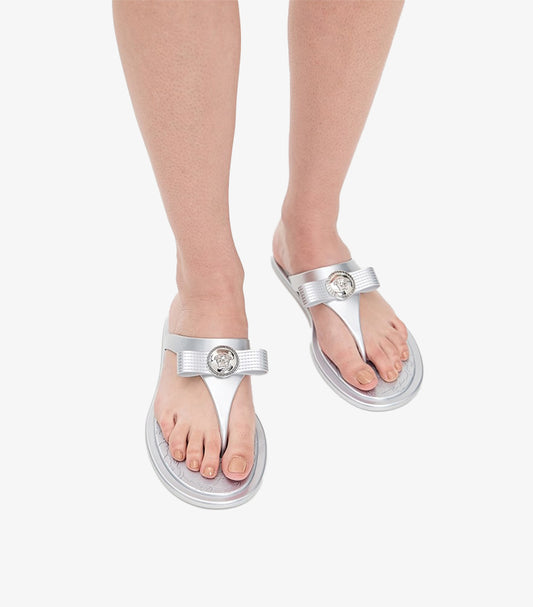 Versace women's silver Medusa slide sandals worn on feet