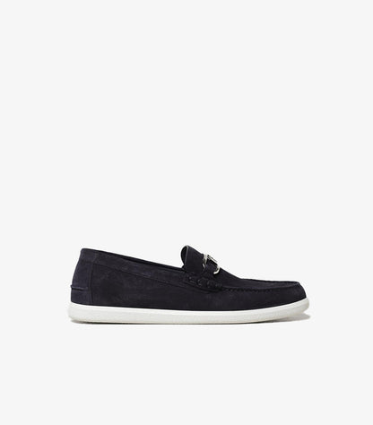 Side profile of Fendi premium suede loafers featuring classic moc toe stitching and designer hardware.
