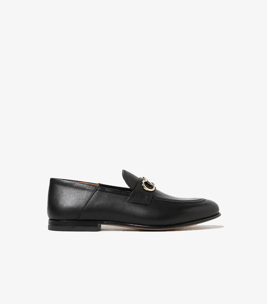 Side view of Ferragamo men’s black leather loafer with gold Gancini hardware and low heel