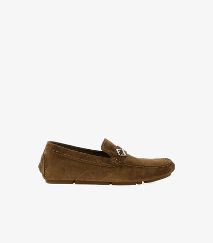Side profile of Fendi men's suede driving loafers with signature FF metal logo and lightweight rubber outsole.