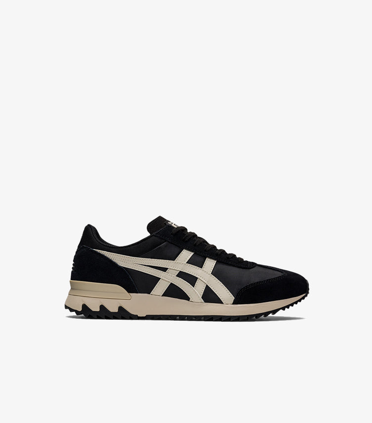 Outer side view of Onitsuka Tiger black and cream low-top sneakers