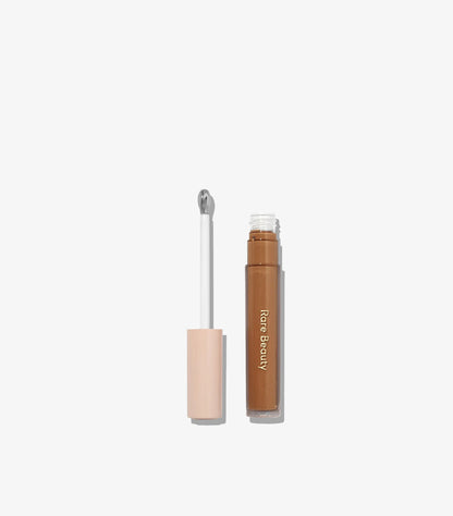 Rare Beauty Positive Light Under Eye Brightener open applicator with liquid formula
