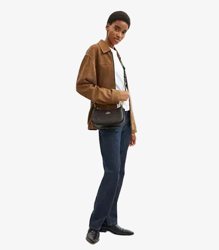 Model wearing Coach Teri walnut bag as crossbody with 22.75 inch strap