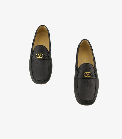 Valentino Garavani men's black pebbled leather driving loafers with gold VLogo hardware top view