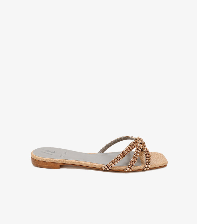 Side view of GINA women’s crystal-embellished flat sandal with slim gold-tone sole