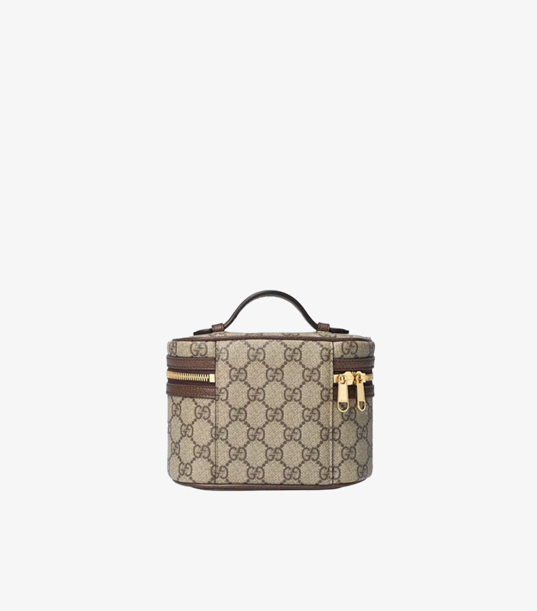 Back view of Gucci GG Supreme cosmetic case showing monogram canvas, top handle and gold zip pulls