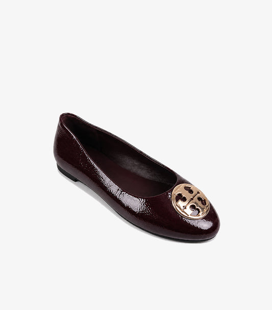 Tory Burch Women's Claire Flat in Deep Burgundy Patent Leather with Gold T Logo – Angled Front View