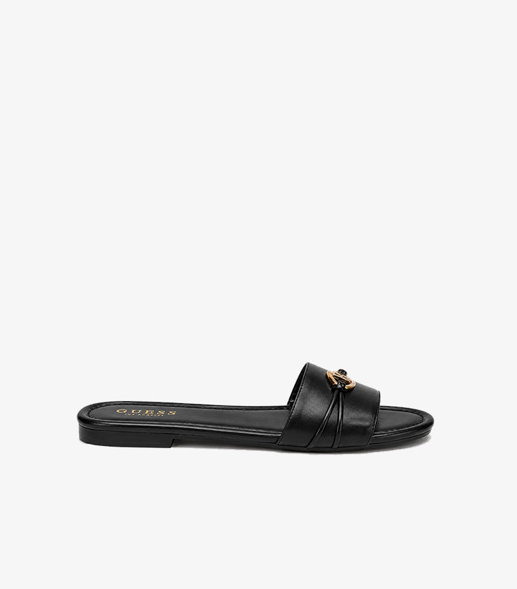 Side view of Guess women’s black open-toe slip-on sandal with low flat sole