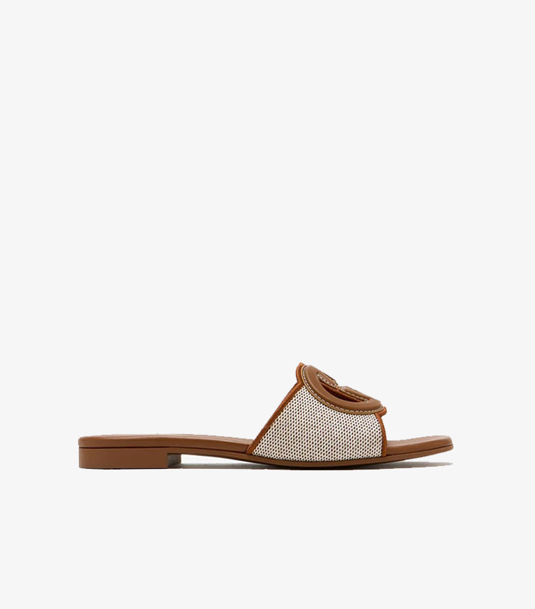 Gucci Interlocking G flat slide sandal tan canvas side profile view showing scalloped leather trim and GG logo