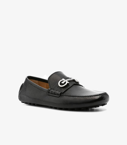 Ferragamo black pebbled leather Gancini silver bit driving loafer angled view showing silver hardware and moccasin construction