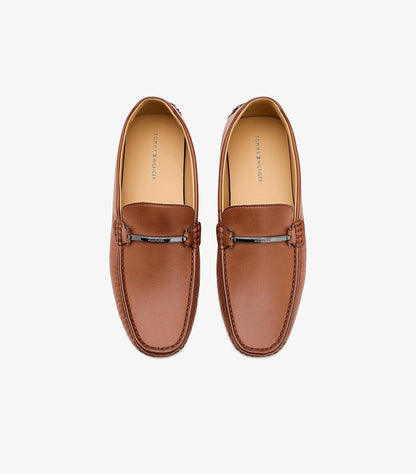 Top view of Tommy Hilfiger men’s brown leather driving loafers with branded metal bars and moccasin stitching