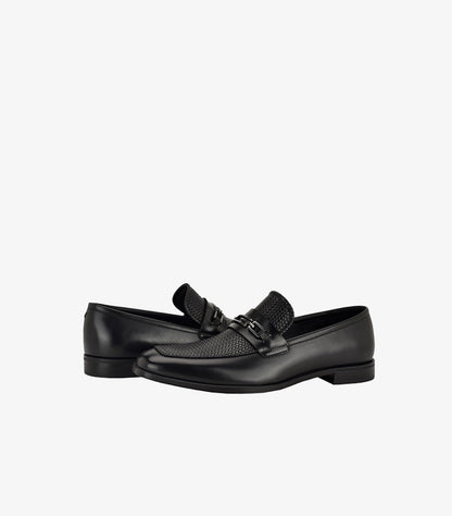 Angled view of Guess men’s black mixed-texture loafers with horsebit hardware and low stacked heel