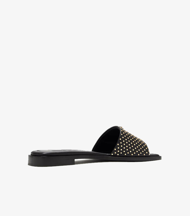 Prada black leather gold micro-stud flat slide sandal rear angled view showing studded strap and black outsole
