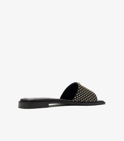 Prada black leather gold micro-stud flat slide sandal rear angled view showing studded strap and black outsole