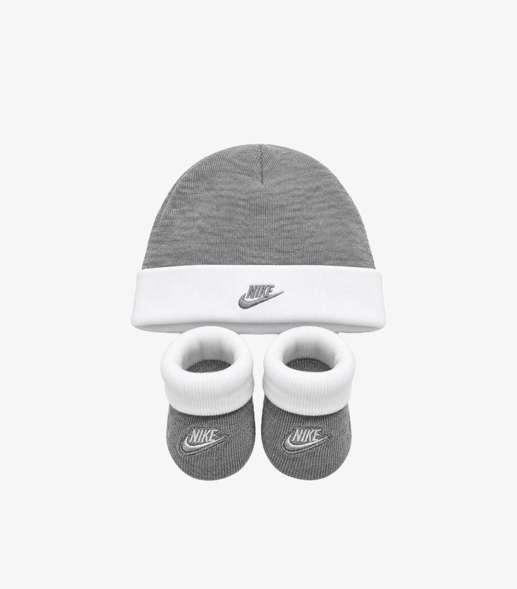 Nike baby two-piece set featuring a grey logo beanie and matching booties with white cuffs