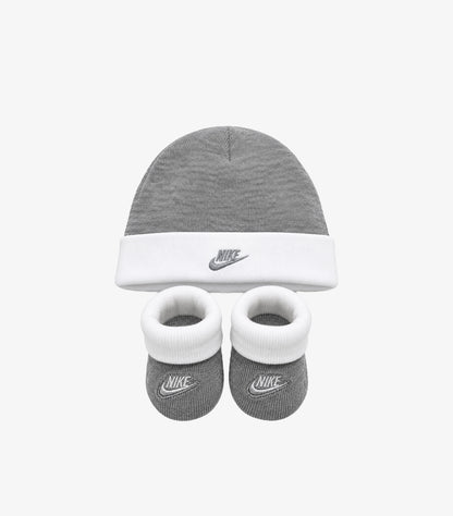 Nike baby two-piece set featuring a grey logo beanie and matching booties with white cuffs