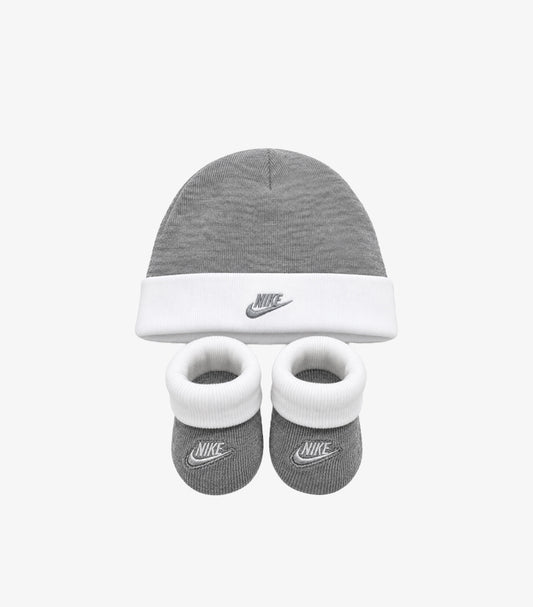 Nike baby two-piece set featuring a grey logo beanie and matching booties with white cuffs