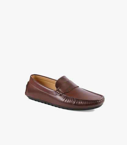 Side view of Tommy Hilfiger men’s brown leather driving loafer with a flexible rubber-studded sole