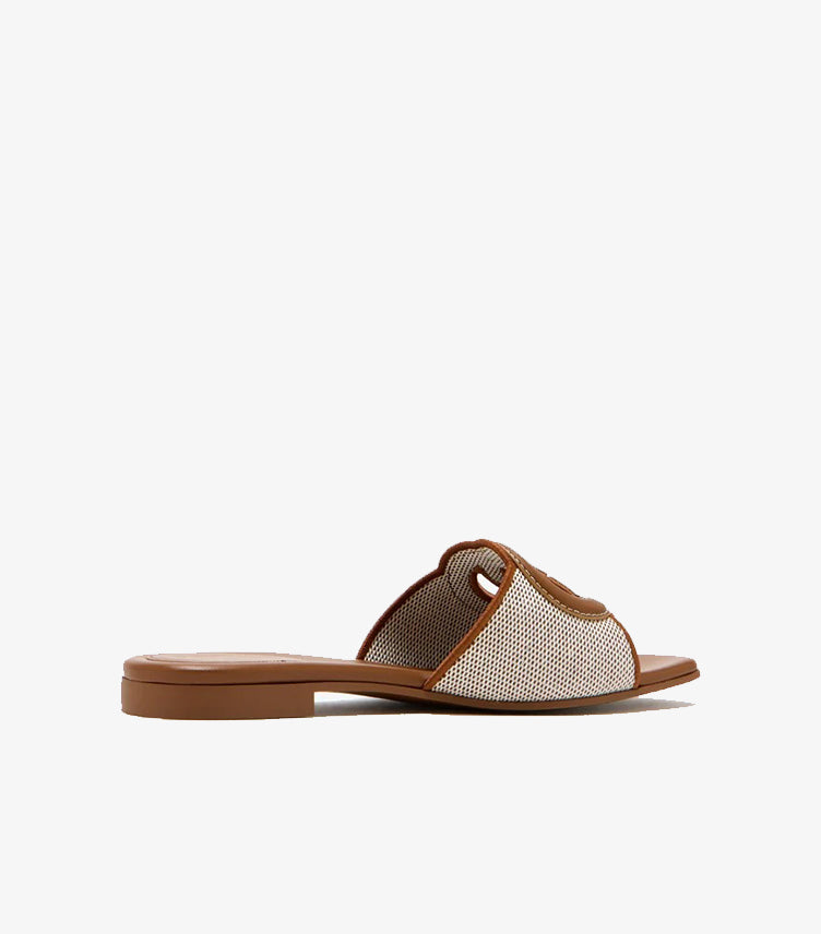 Gucci tan canvas flat slide sandal right side profile showing GG cutout logo scalloped trim and tan leather outsole