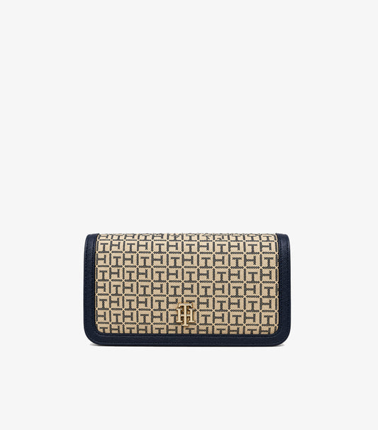 Front view of Tommy Hilfiger TH monogram shoulder bag with contrasting trim and gold-tone logo emblem