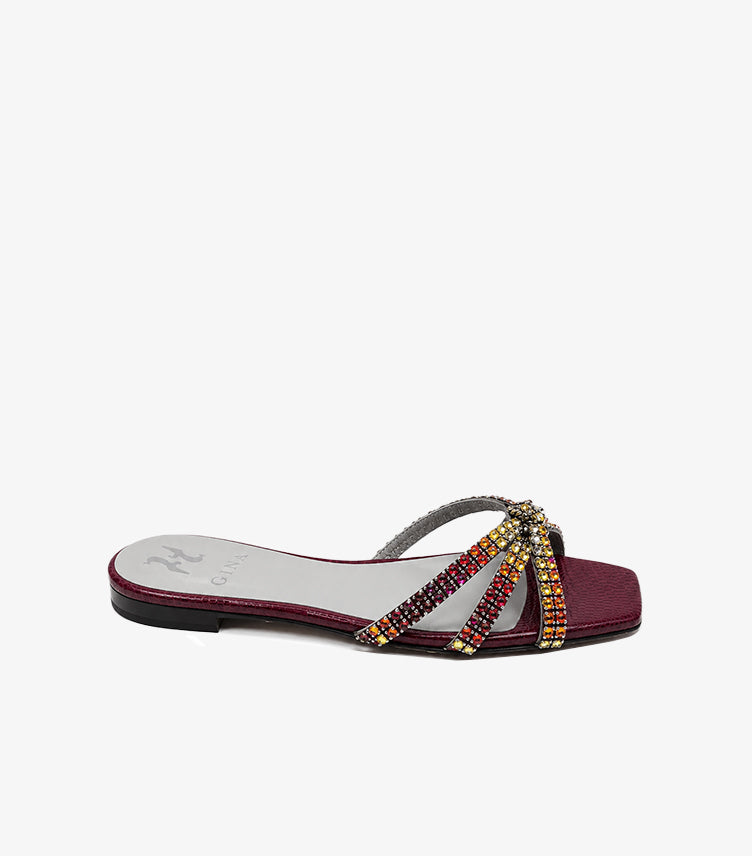 Side view of GINA women’s burgundy flat sandal with multicoloured crystal crossover straps