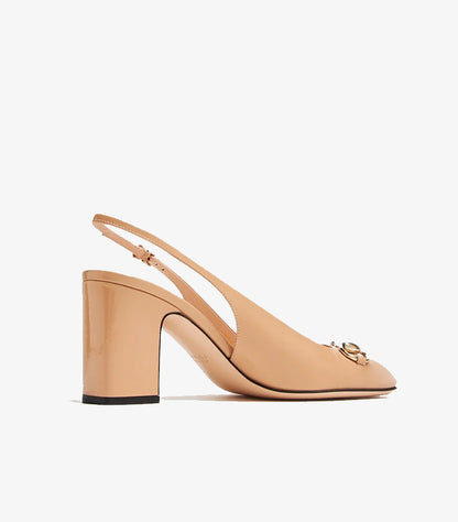Side view of Gucci tan patent leather slingback pumps
