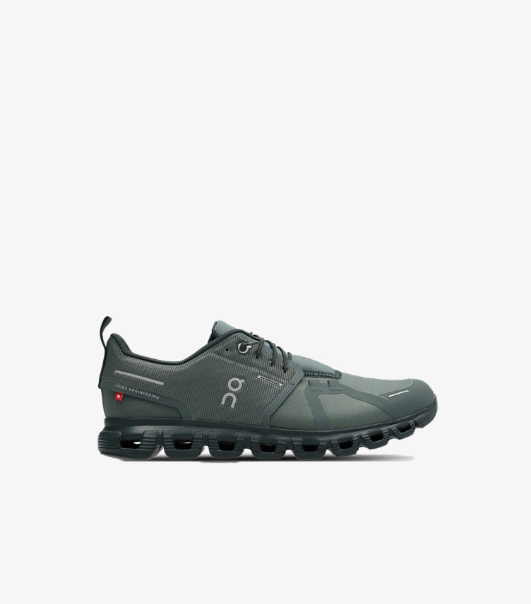 Side view of On Running Cloud trainers showing the panelled upper, On logo and segmented hollow-pod sole