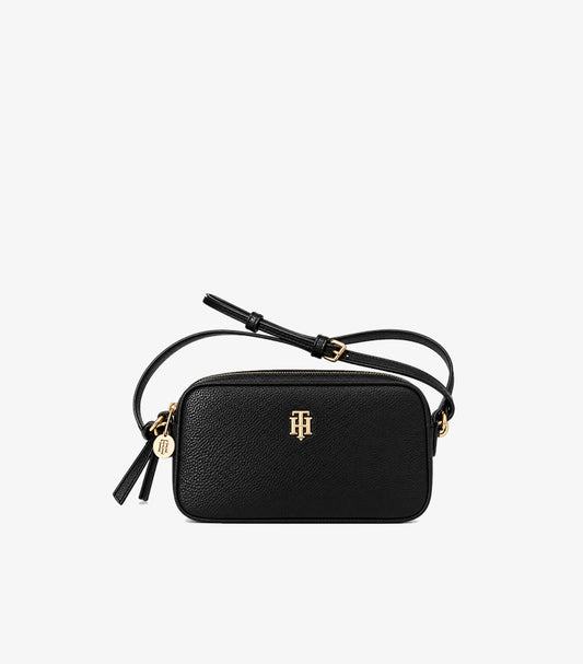 Tommy Hilfiger Black Crossbody Camera Bag featuring textured finish, gold-tone monogram logo, adjustable strap and zip closure.