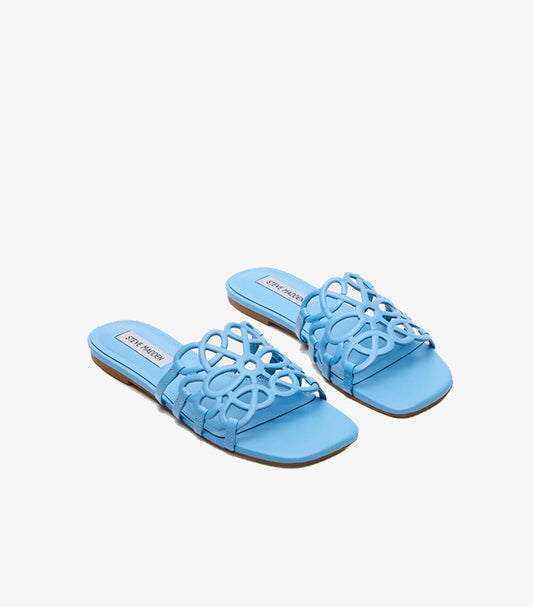 Pair of Steve Madden women’s blue flat sandals featuring decorative laser-cut straps